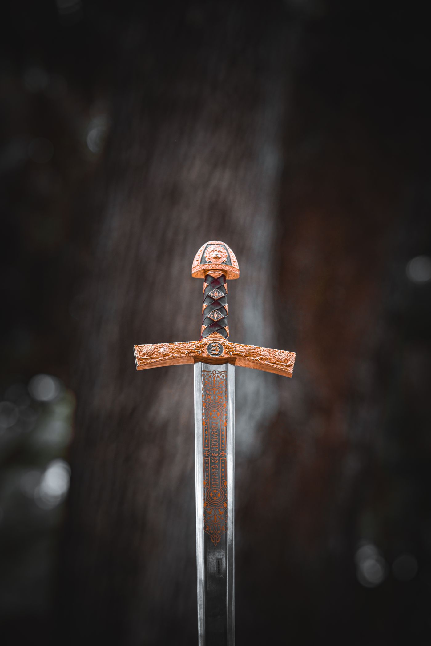 Ornate sword hilt and blade outdoors, a thematic photograph for Ned Stark’s exercise of justice.