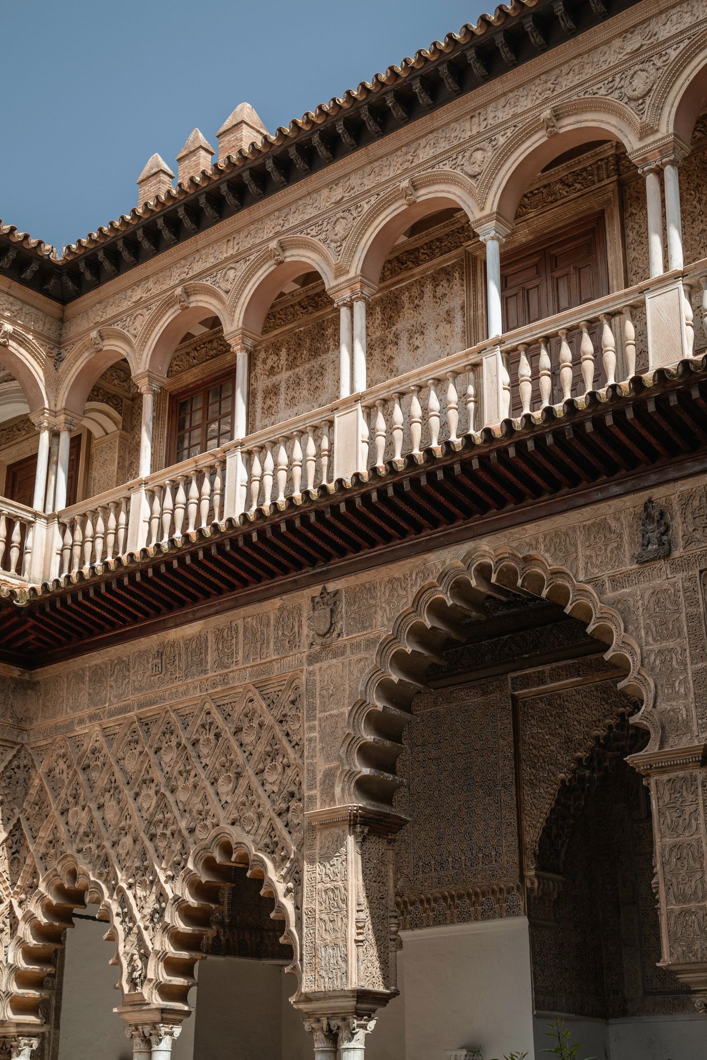 The intricately arched courtyard of the Real Alcázar in Seville